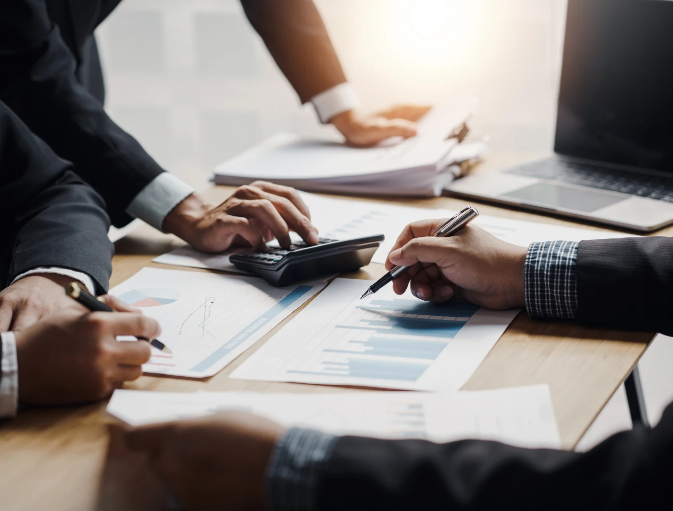 Business team analyzing financial documents